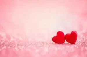 Two hearts on pink background