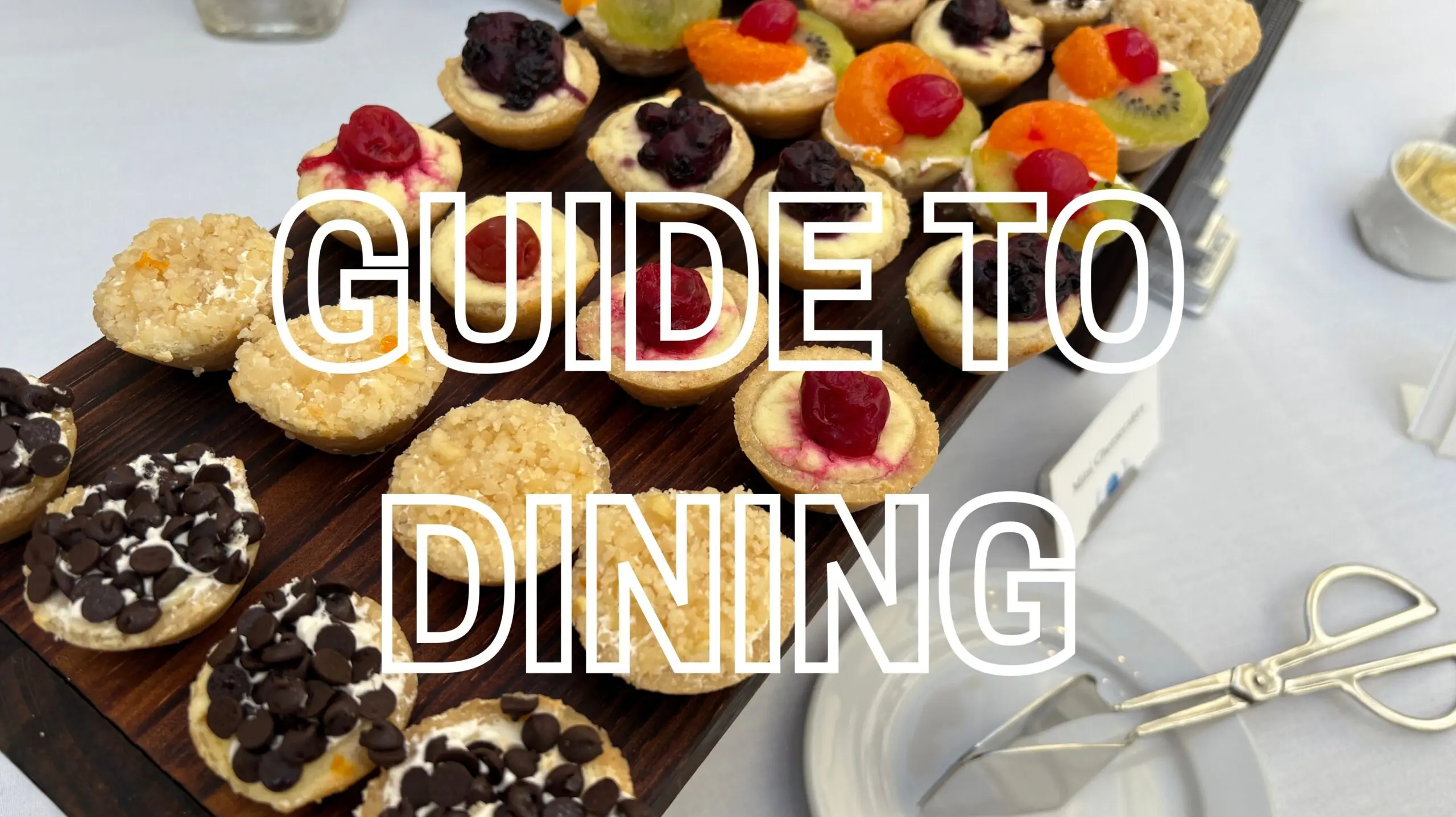 Dessert spread behind text stating Guide to Dining